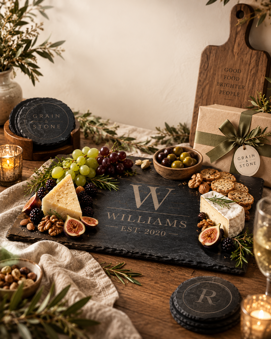 A table set with personalized boards, coasters and gifts